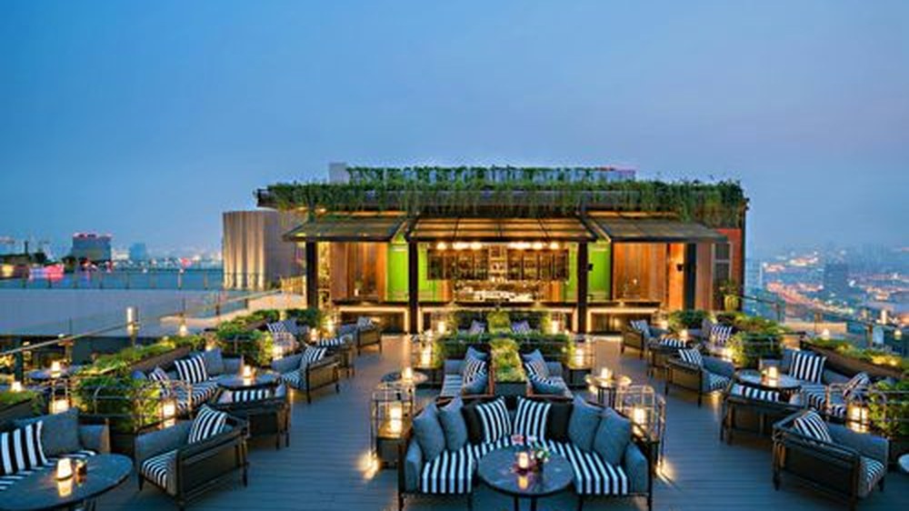 ABar Rooftop terrace at Bangkok Marriott Marquis Queen's Park at dusk, overlooking the Bangkok skyline